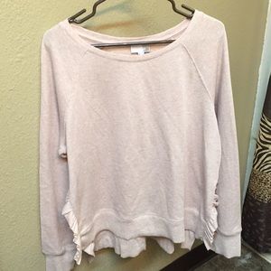 Pink sweatshirt with ruffled side-slits